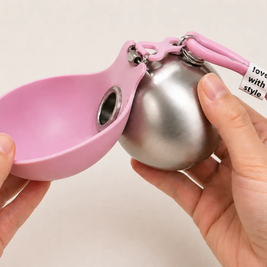 Silicone cover folded out into a dog bowl beside the steel bottle